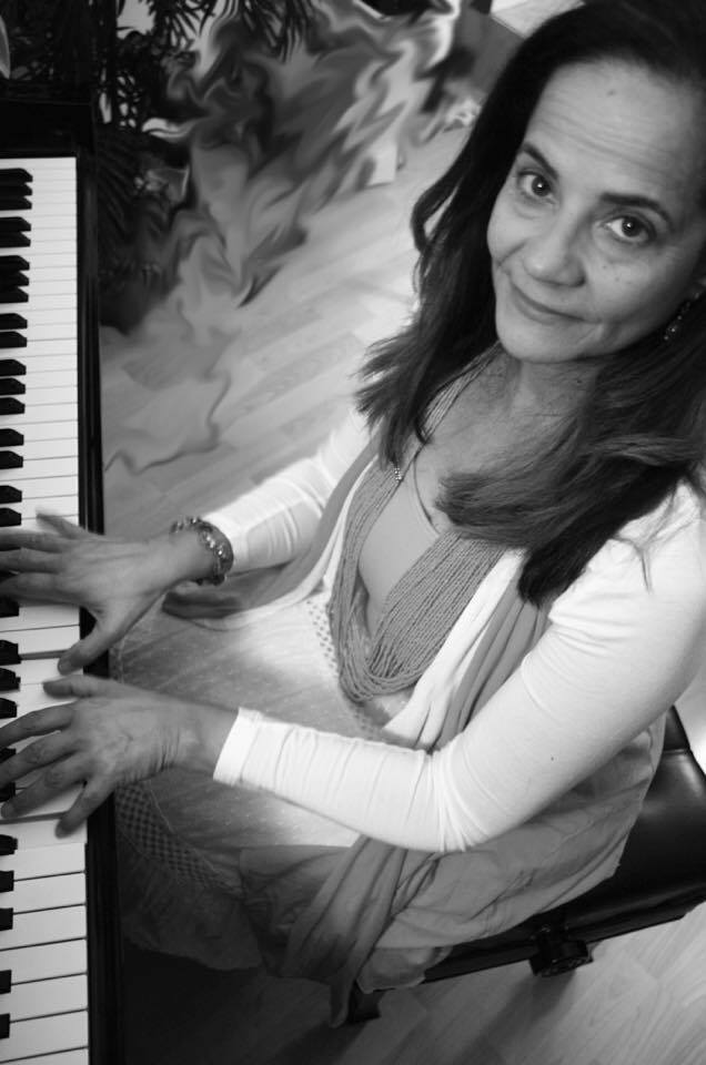 Suzzette Ortiz playing piano